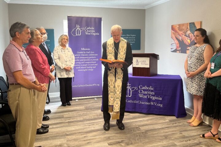 Bishop Mark Brennan blesses Catholic Charities West Virginia offices at Hazel’s House of Hope in Morgantown.