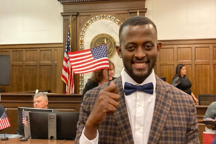Photo of Promise holding American flag
